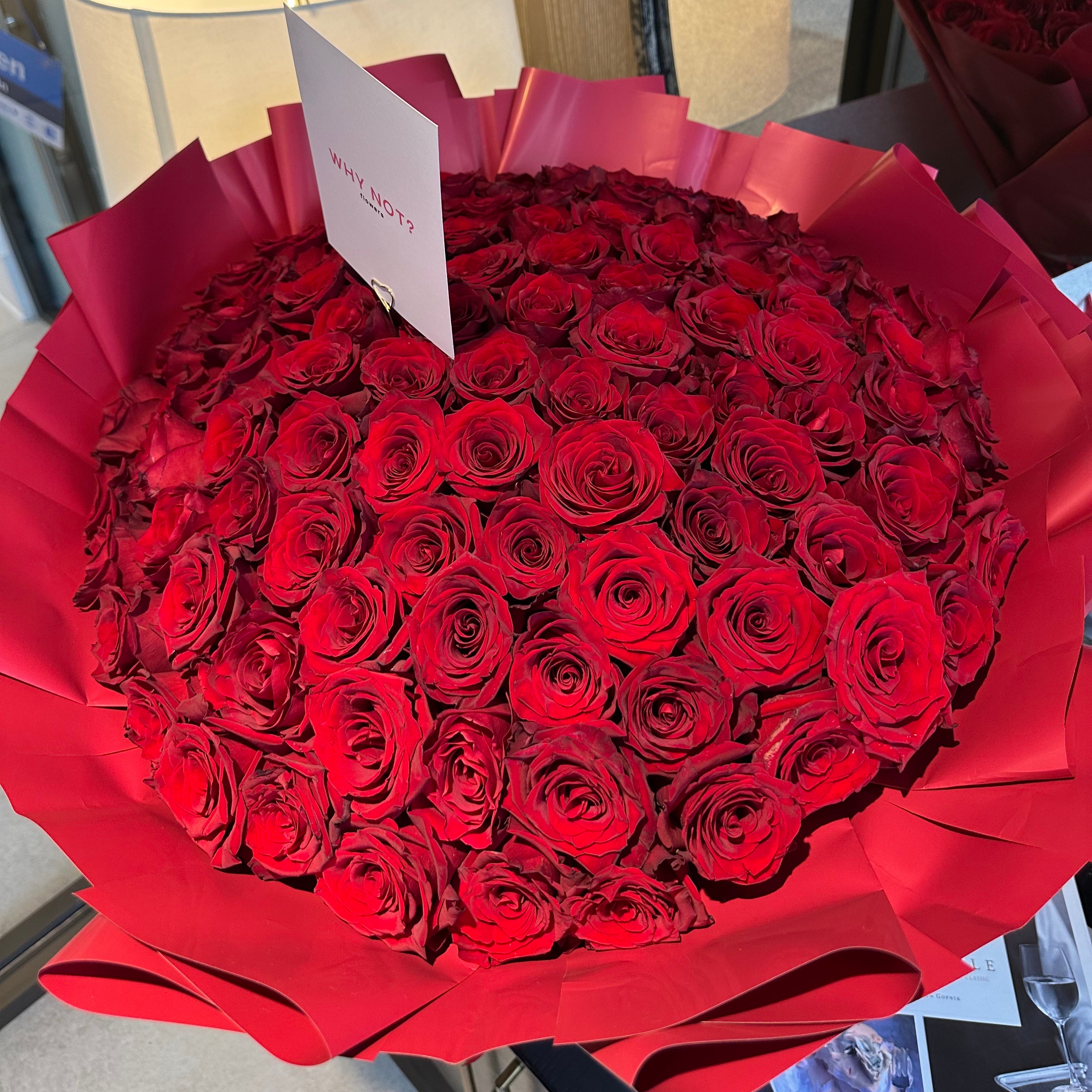 100 Premium Red Roses in Red Wrap