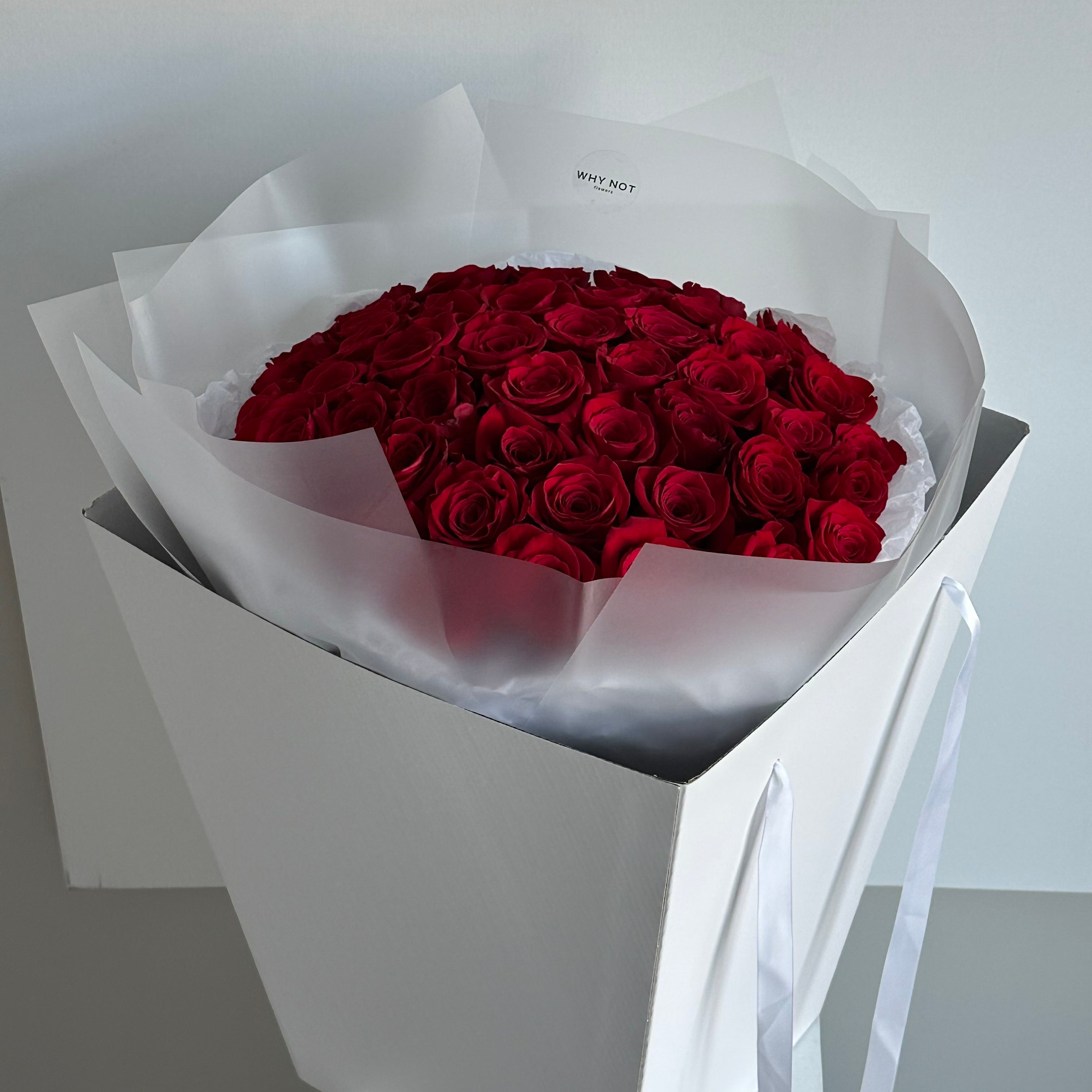 50 Red Roses in Clear Wrap