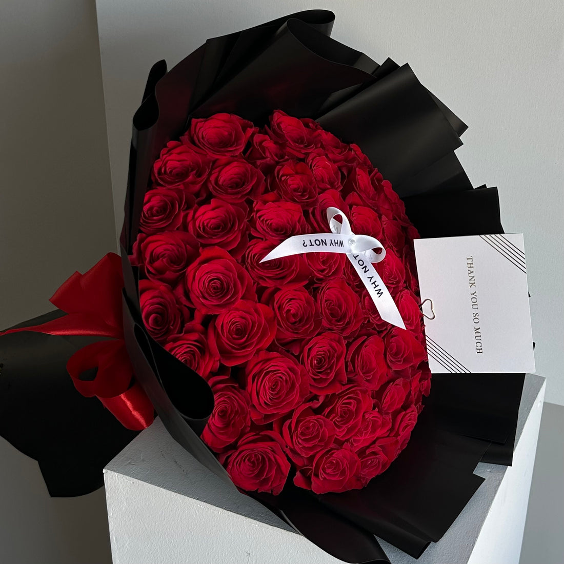 50 Red Roses in Black Wrap