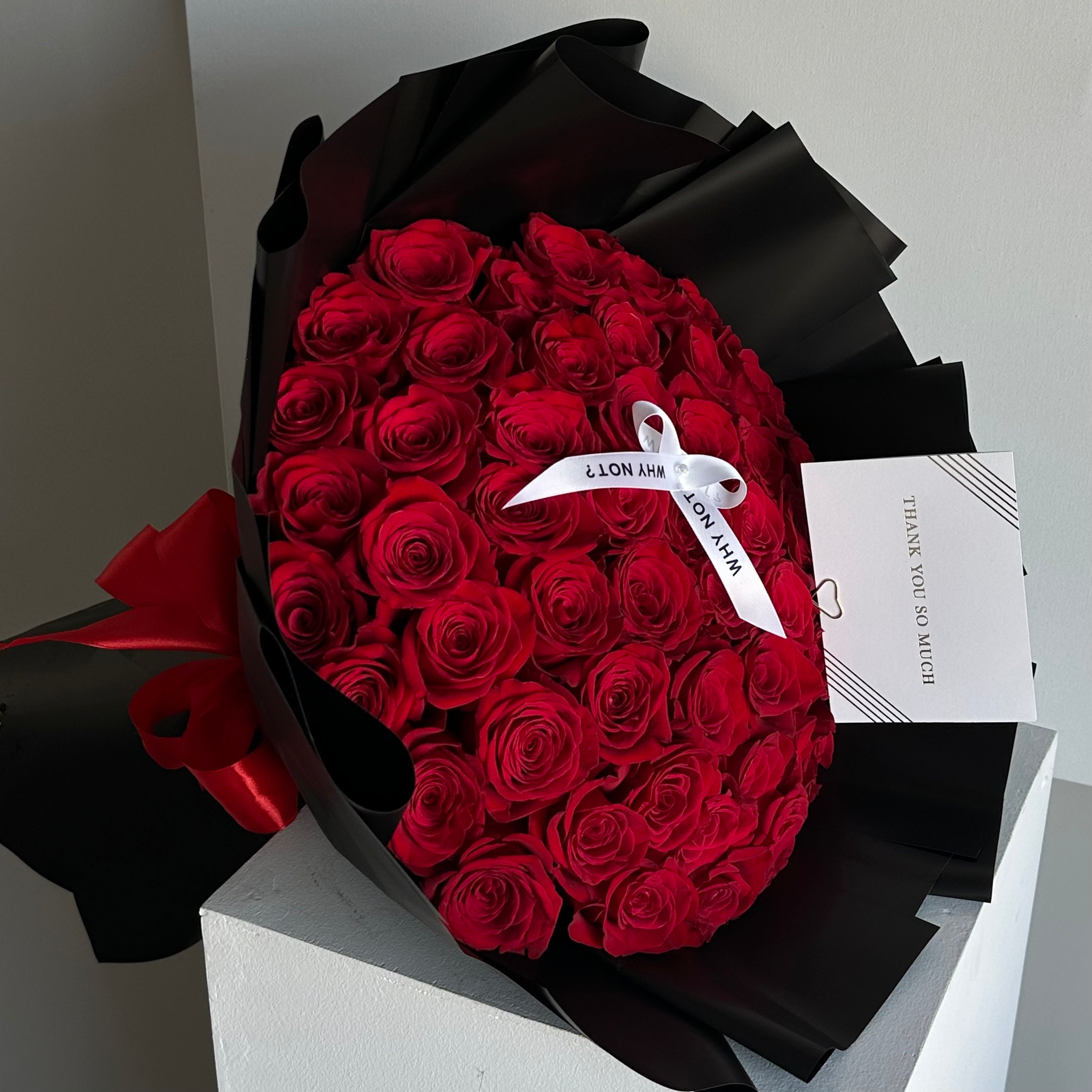 50 Red Roses in Black Wrap