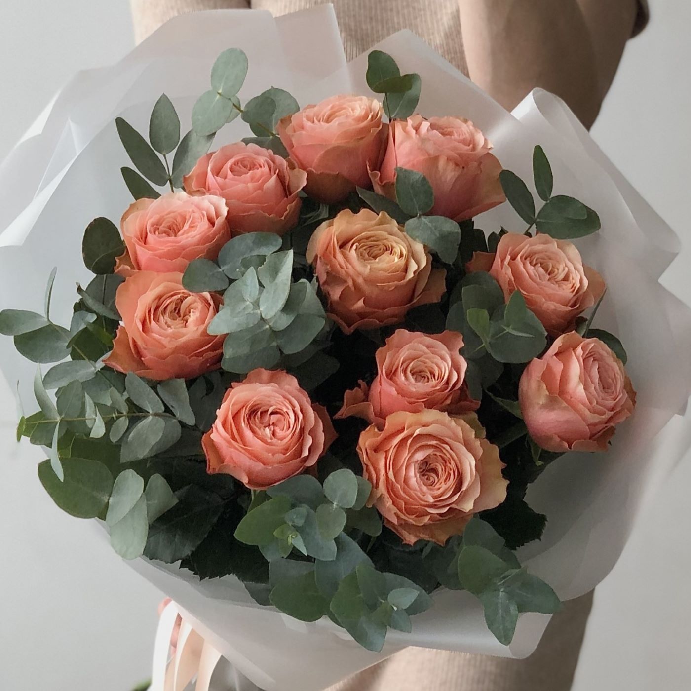 Orange-peach roses with eucalyptus
